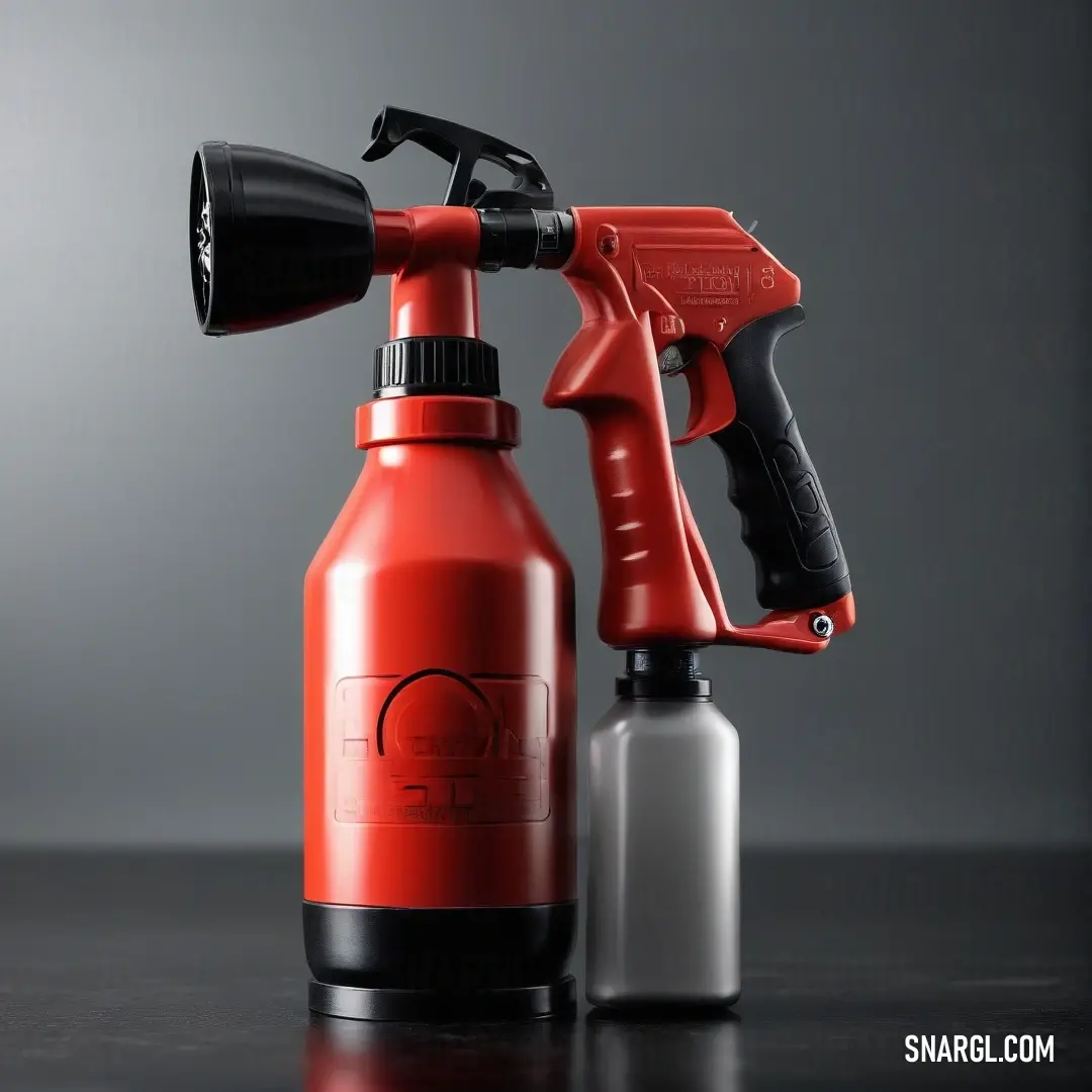 A striking red spray gun sits next to a pristine white spray bottle on a sleek gray surface. The vivid colors create an eye-catching contrast, hinting at creativity and craftsmanship, whether in art projects or home improvements.