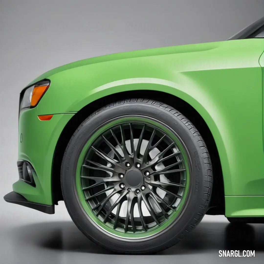 Green car with a black rim and chrome spokes on it's wheels and tires, with a gray background. Color RGB 122,211,102.