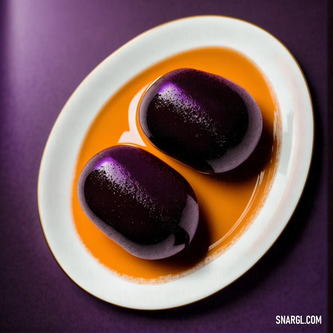 Two purple eggs are on a white plate on a purple tablecloth with a purple background. Color #F49A0A.
