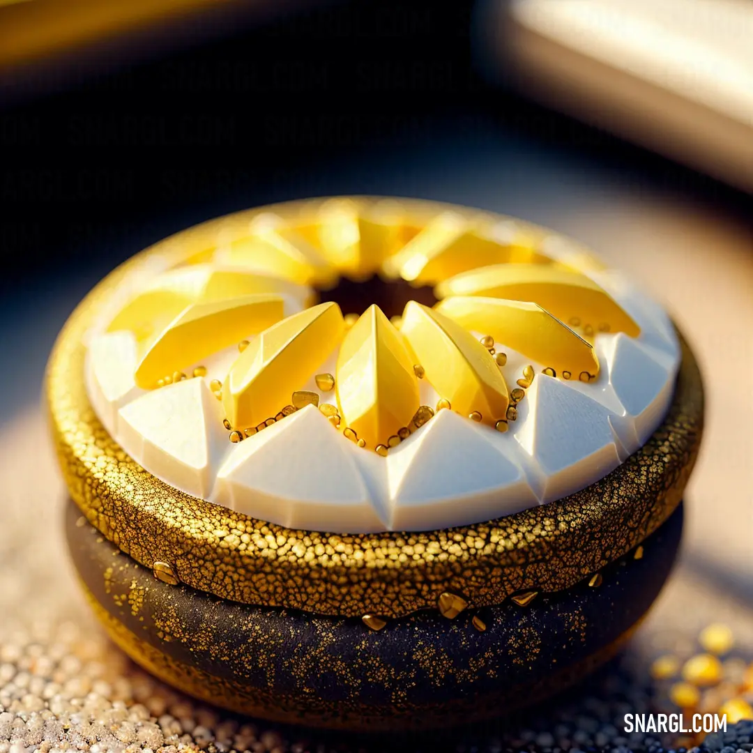 NCS S 0580-Y color example: Decorative box with gold and white decorations on it's lid and a gold rimmed lid and bottom
