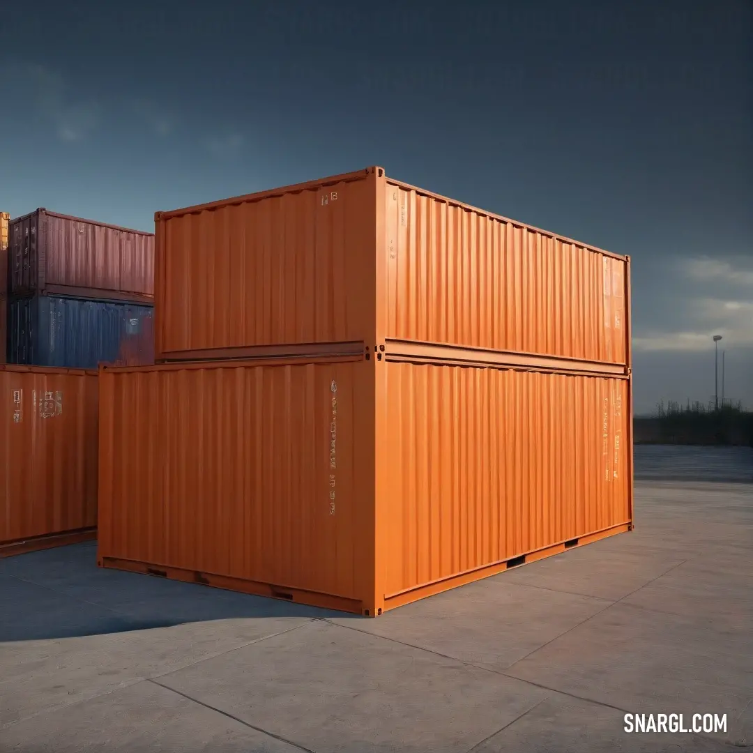 A pair of bold orange containers stands out against a rough cement ground, set under an overcast sky. Their vibrant hue adds a pop of color to a typically muted background, capturing a moment of urban beauty.