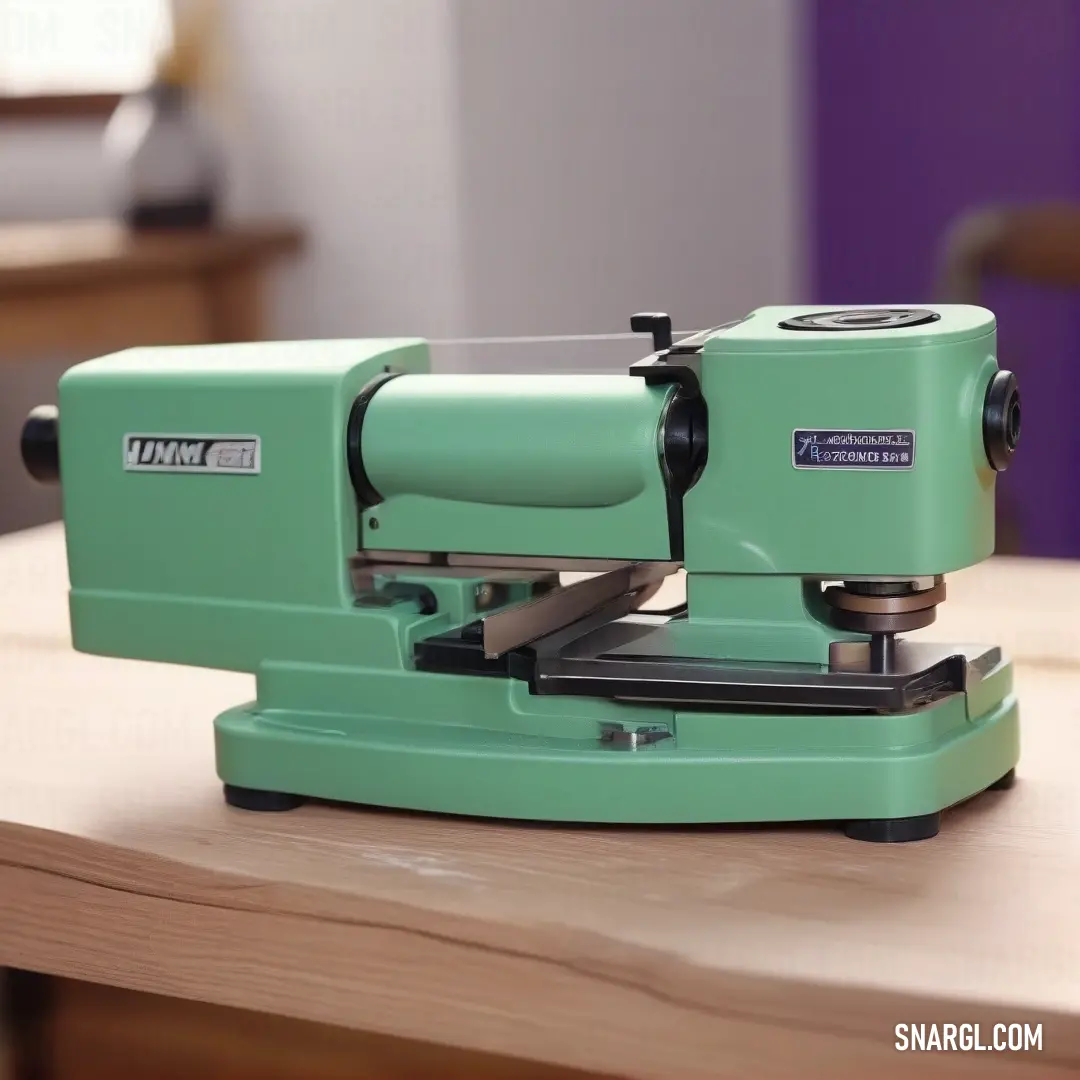 NCS S 1015-B80G color example: Green machine on top of a wooden table next to a window with a purple wall behind it