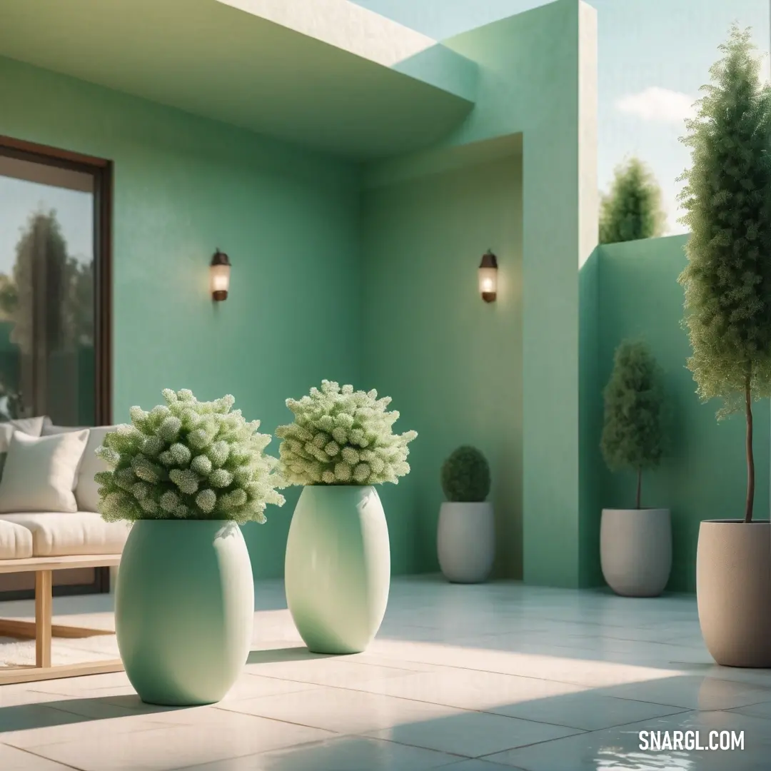 Three vases with flowers in them on a tiled floor in front of a couch and a window with a view of a patio. Color RGB 214,247,219.