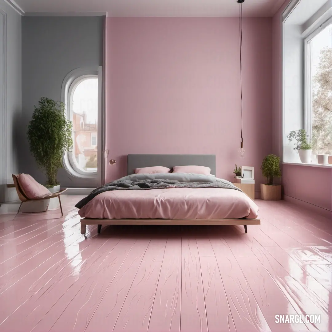 Bedroom with a pink wall and a bed in it with a pink blanket on it and a window. Color RGB 229,210,220.