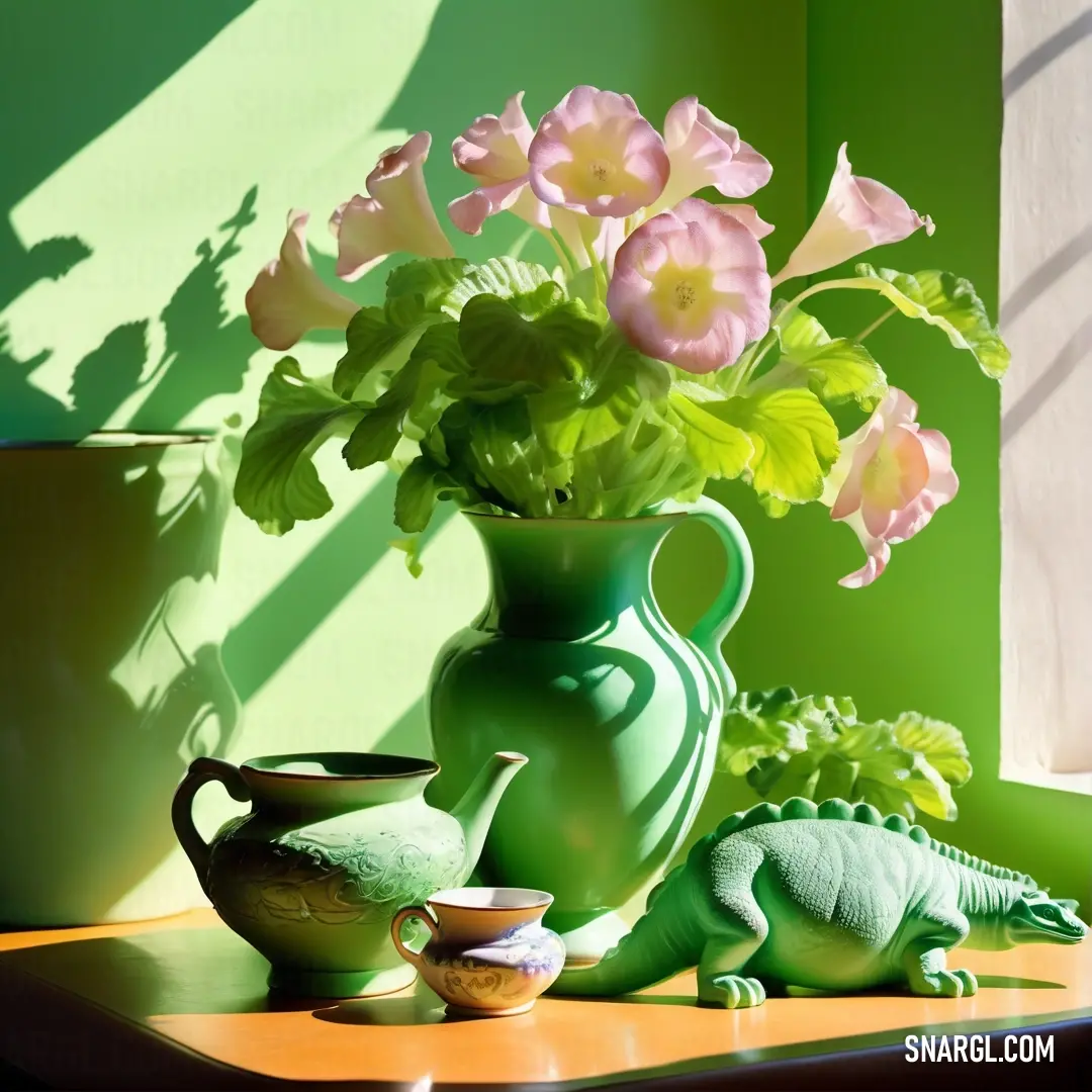 Green vase with flowers and a small toy alligator on a table next to a window with a green wall. Color NCS S 1020-G.