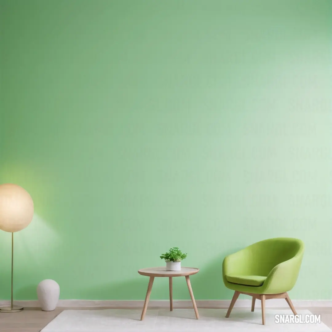 Green room with two chairs and a table with a plant on it and a lamp on the side. Color NCS S 1030-G30Y.