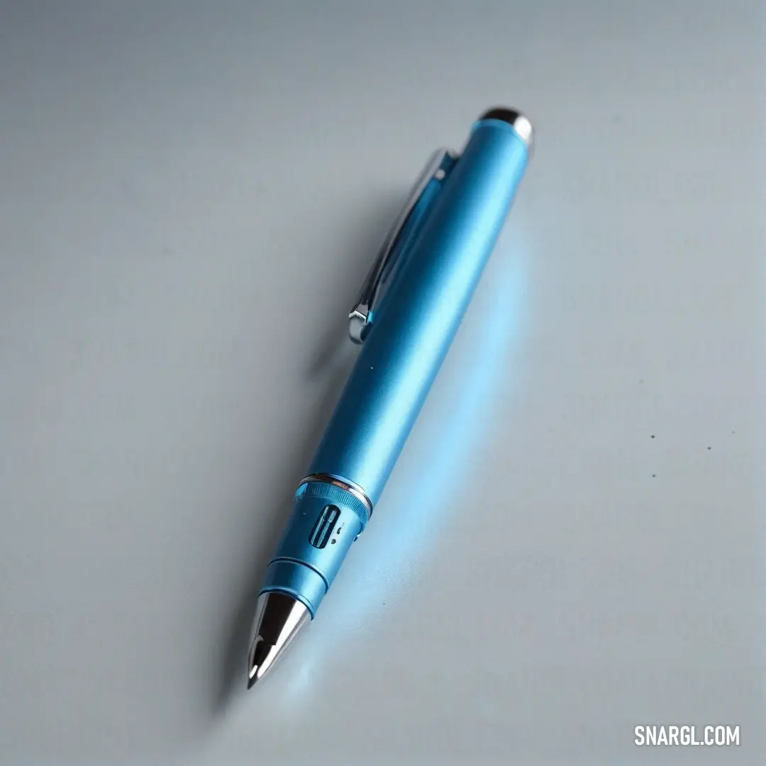 A sleek blue pen elegantly rests atop a crisp white surface, its shiny black tip contrasting beautifully with the brightness around it, creating an aura of sophistication perfect for any writing endeavor.