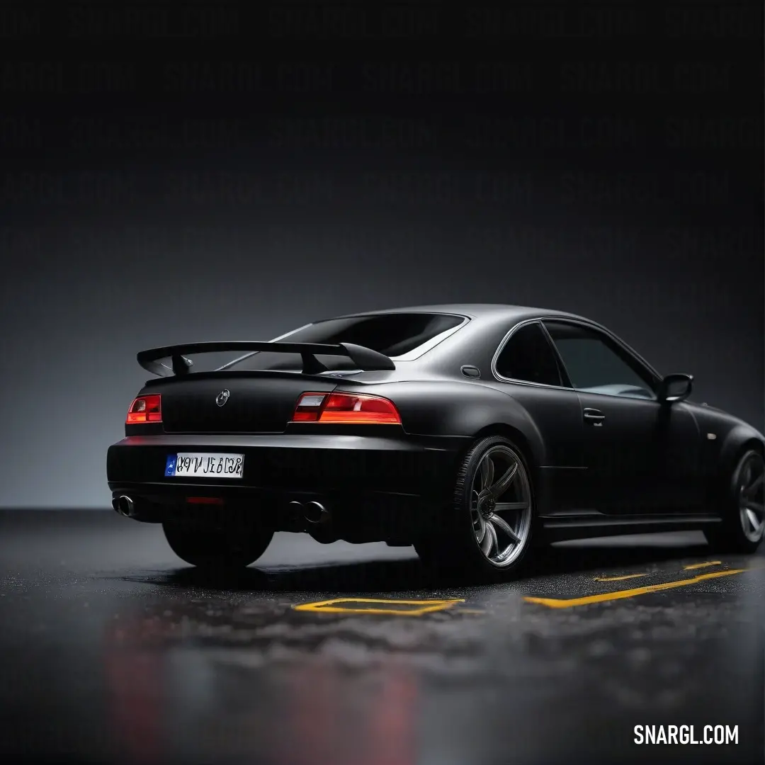 A sleek black sports car parked stylishly in a well-lit parking lot, showcasing its glossy finish and aerodynamic curves. The bold yellow line enhances the dramatic visual, framed by a contrasting black backdrop.