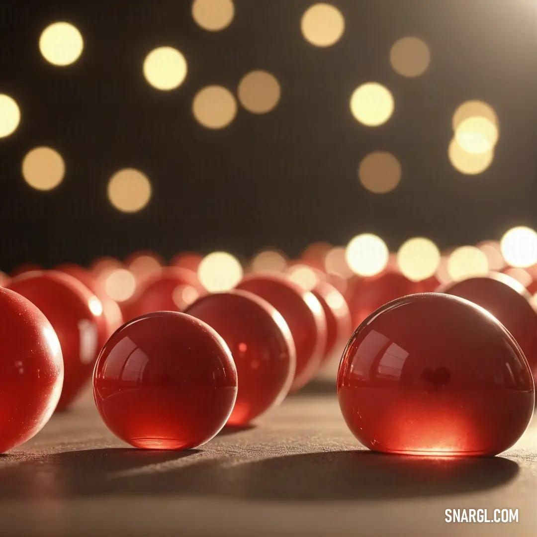 An array of bright red balls artfully arranged on a table, set against a backdrop of shimmering lights, creating a festive and joyous atmosphere filled with vibrancy.