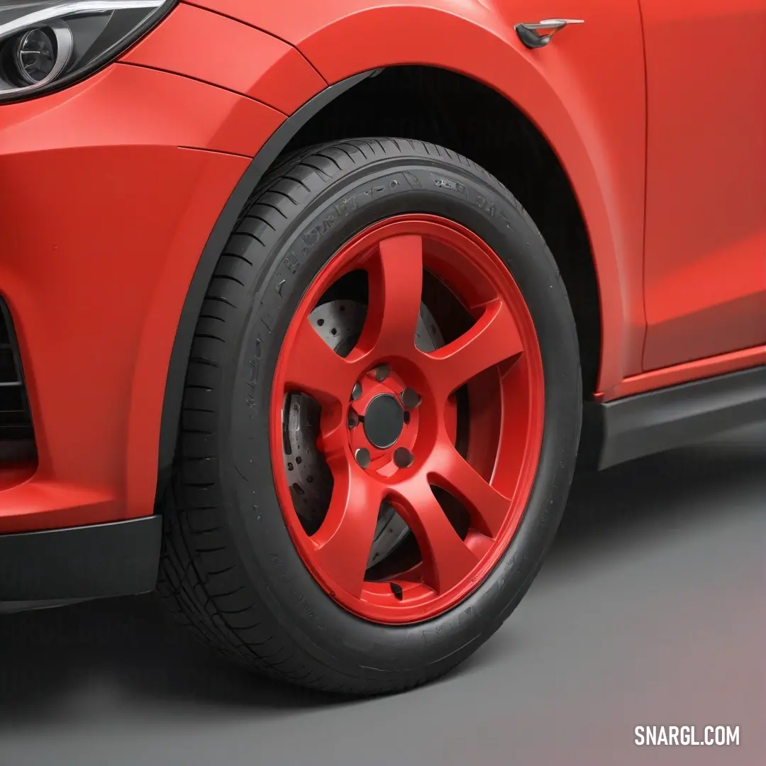 A shiny red car showcases its sporty design featuring sleek black rims and striking red brake pads, parked against an elegant backdrop, inviting an exhilarating journey.