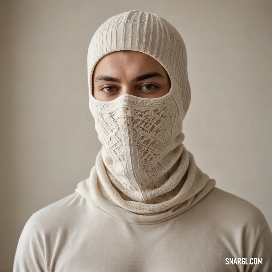 A man bundled in a cozy white knitted mask, draped in a matching sweater and scarf, blends perfectly with a serene winter landscape, embodying a sense of warmth and tranquility while demonstrating the gentle hues of the #E7D59F color palette.