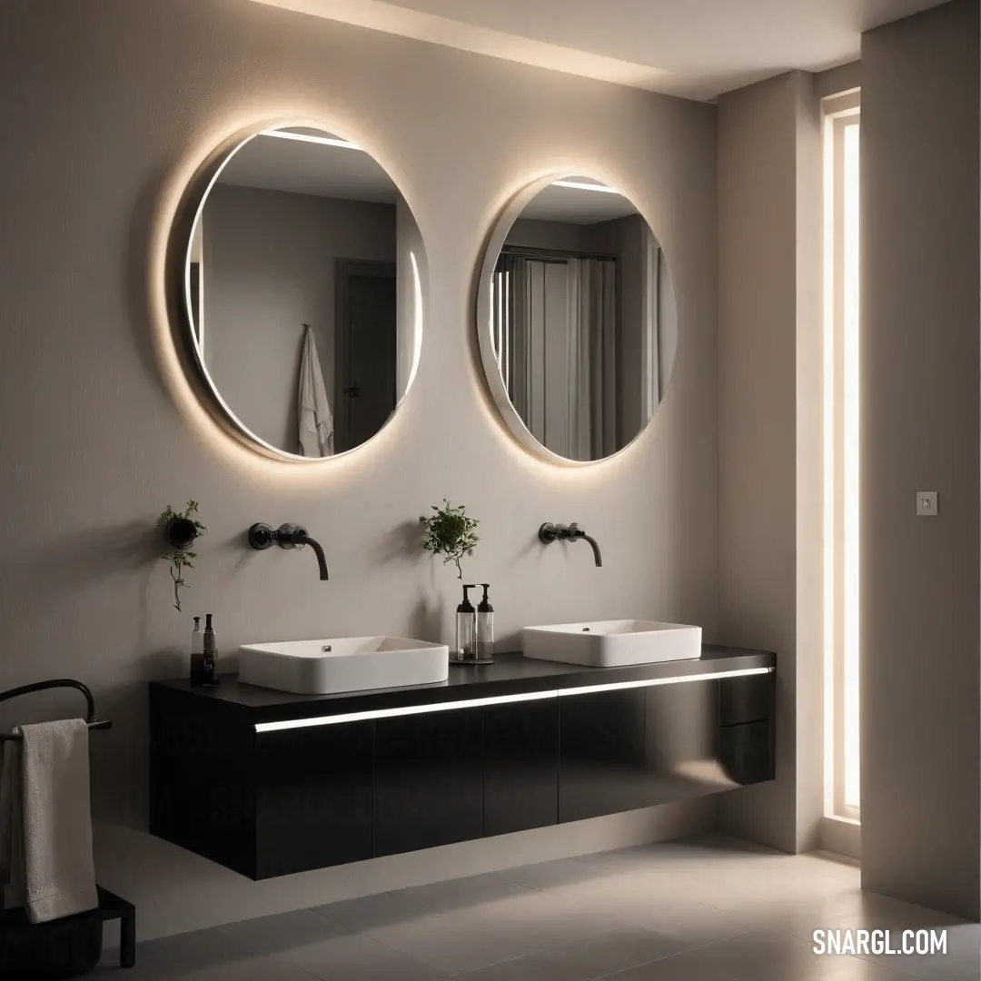 This modern bathroom is elegantly designed with two sleek sinks and stylish mirrors, emphasizing minimalist aesthetics while a soft towel rack completes the inviting atmosphere, embodying sophistication and comfort in a personal space.