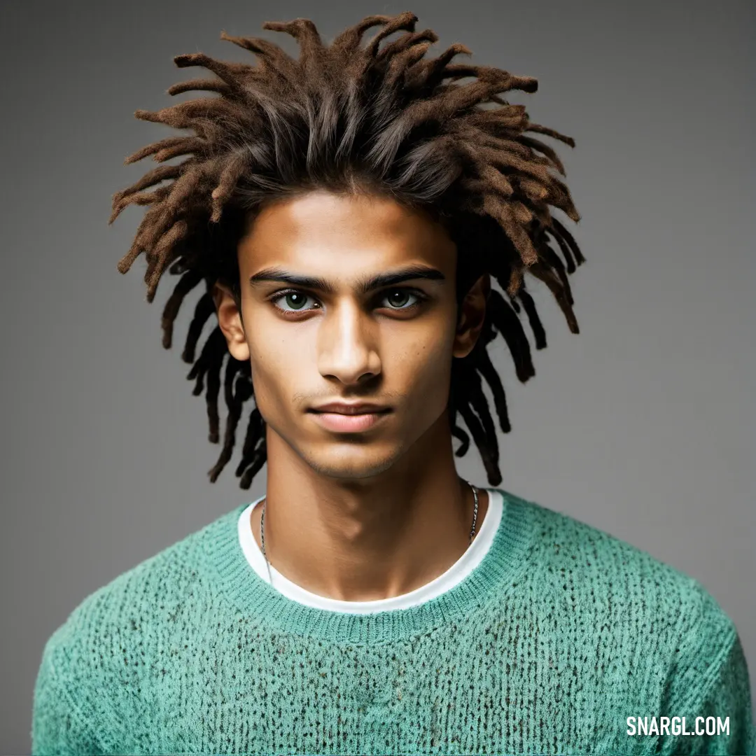 Man with dreadlocks on his head and a green sweater on his shoulders. Example of CMYK 49,0,36,5 color.
