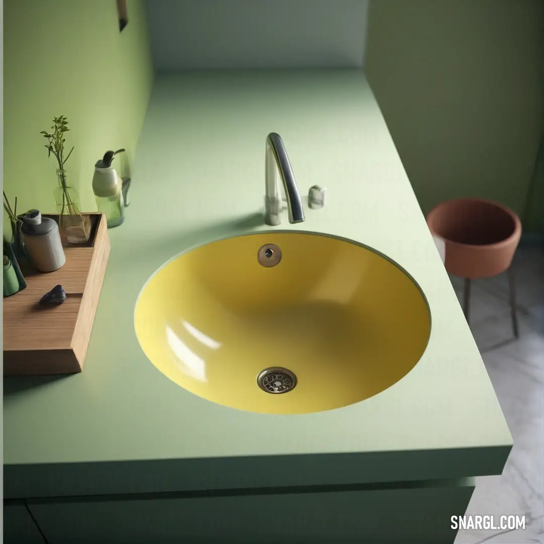 Sink with a yellow bowl on top of it next to a counter top with a plant in a pot. Example of NCS S 2020-G30Y color.