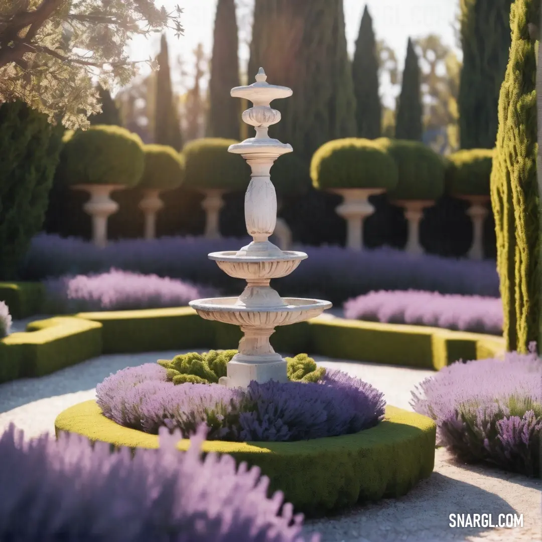 Garden with a fountain surrounded by lavender flowers and trees in the background. Example of RGB 171,162,198 color.