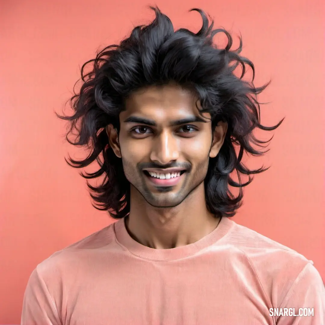 Man with a long black hair and a smile on his face and a pink background. Color #D69990.