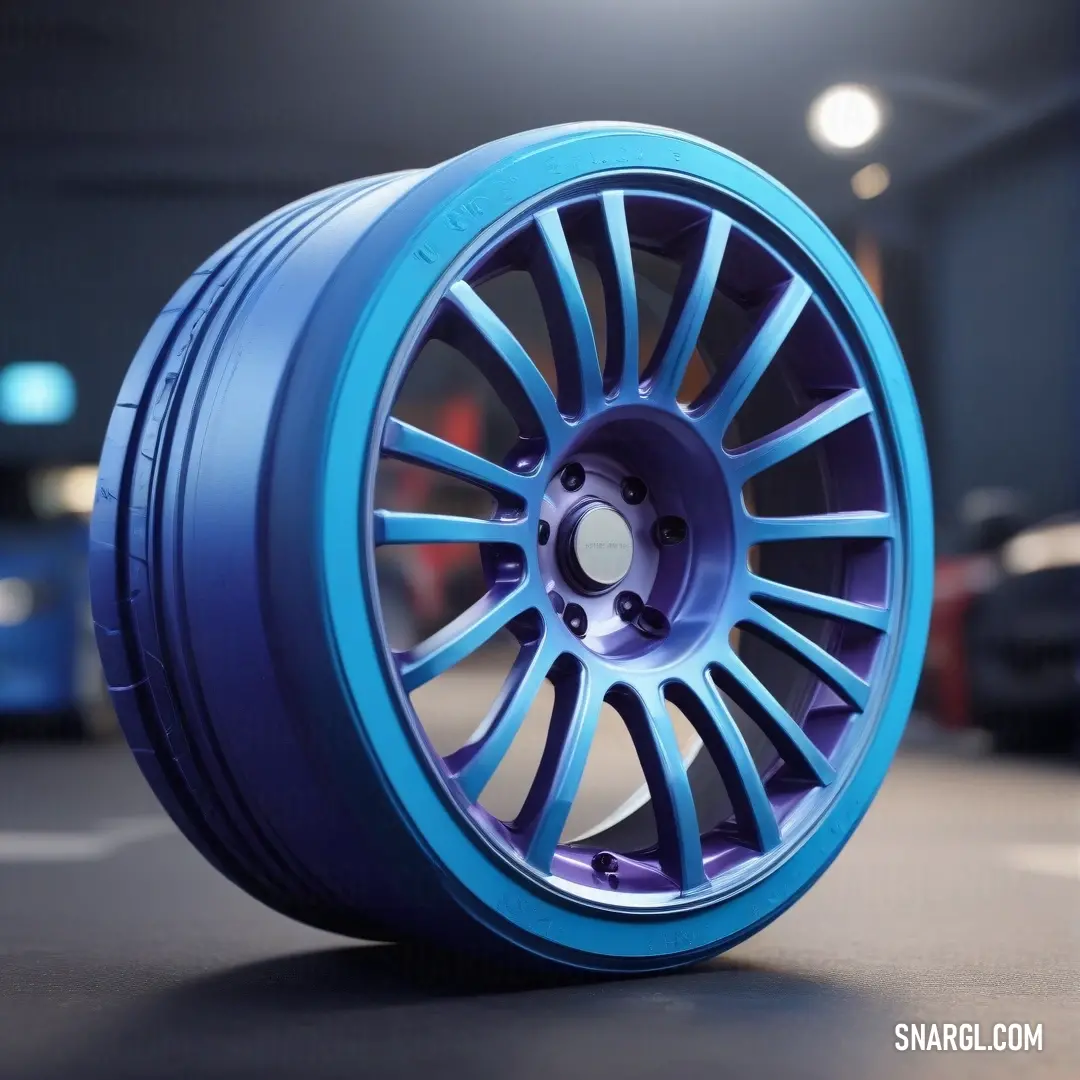 A vivid blue wheel stands out against a sleek black surface, set in a garage filled with the subtle ambiance of a car shadowed in the background. The image showcases a unique blend of automotive design and color dynamics, exemplifying CMYK 55,65,0,0.