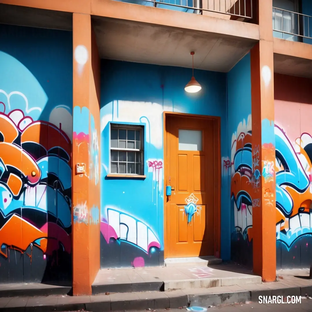 Building with a bunch of graffiti on it's side wall and a door with a window and a light. Example of NCS S 2050-Y40R color.