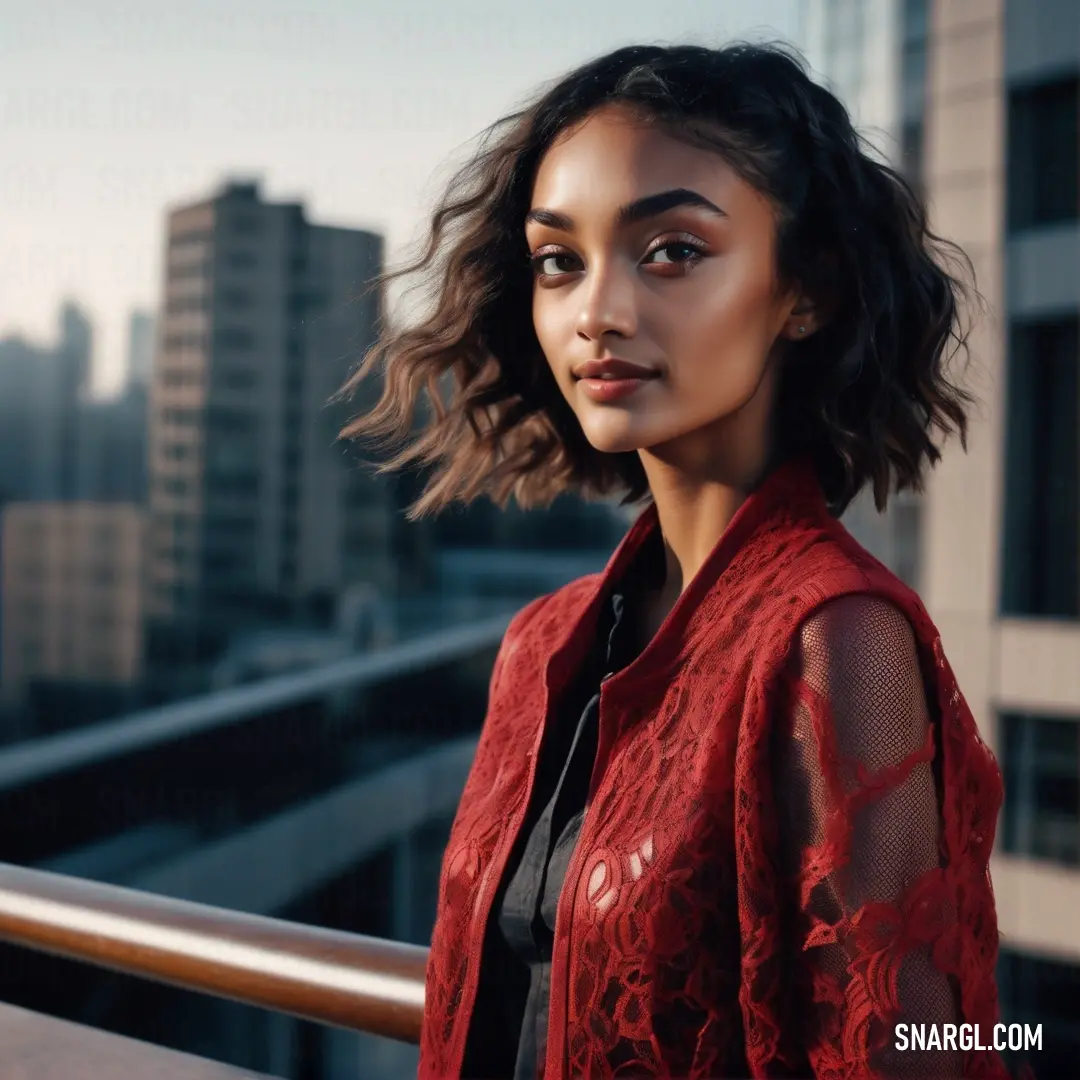 Woman standing on a balcony in a red jacket and black shirt with a city skyline in the background. Color CMYK 0,100,70,40.