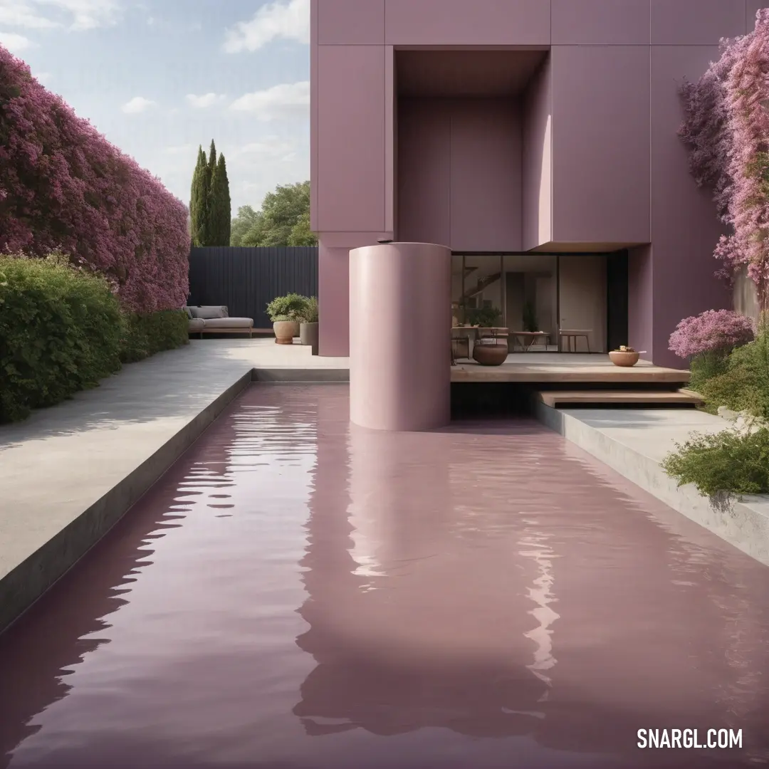 Pink building with a pool in front of it. Color CMYK 0,22,10,38.