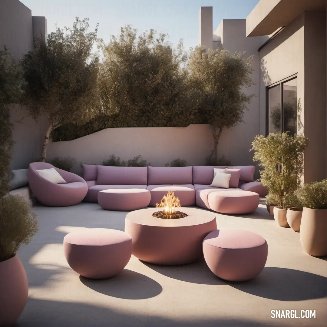 Patio with a fire pit and seating area with trees in the background. Color RGB 166,115,109.