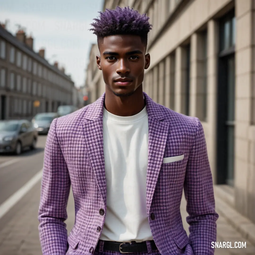 Man with a purple hair standing in front of a building wearing a purple jacket and white shirt and black pants