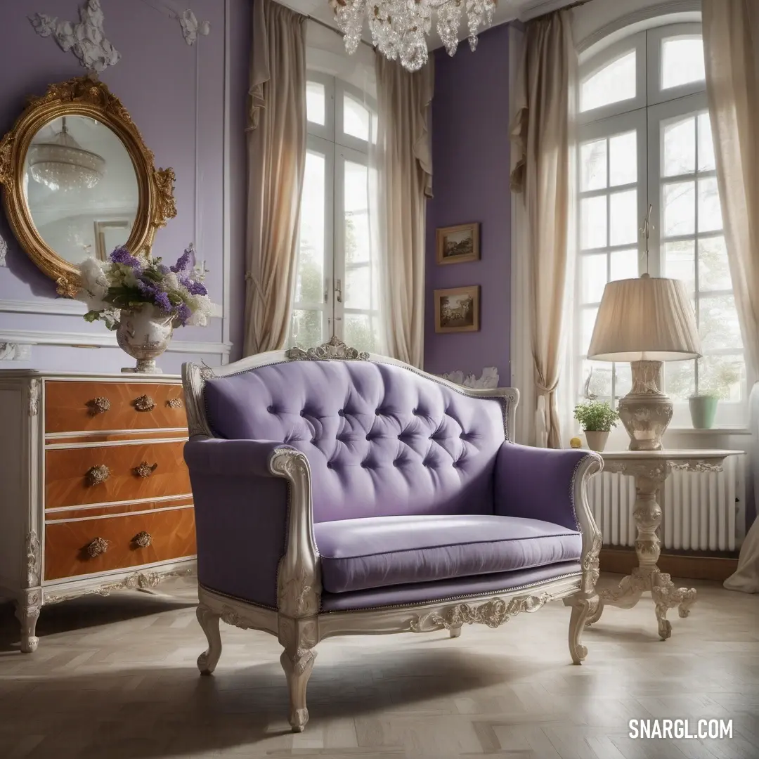 Purple couch in a living room next to a window with a chandelier hanging from it. Color #9F8AA6.