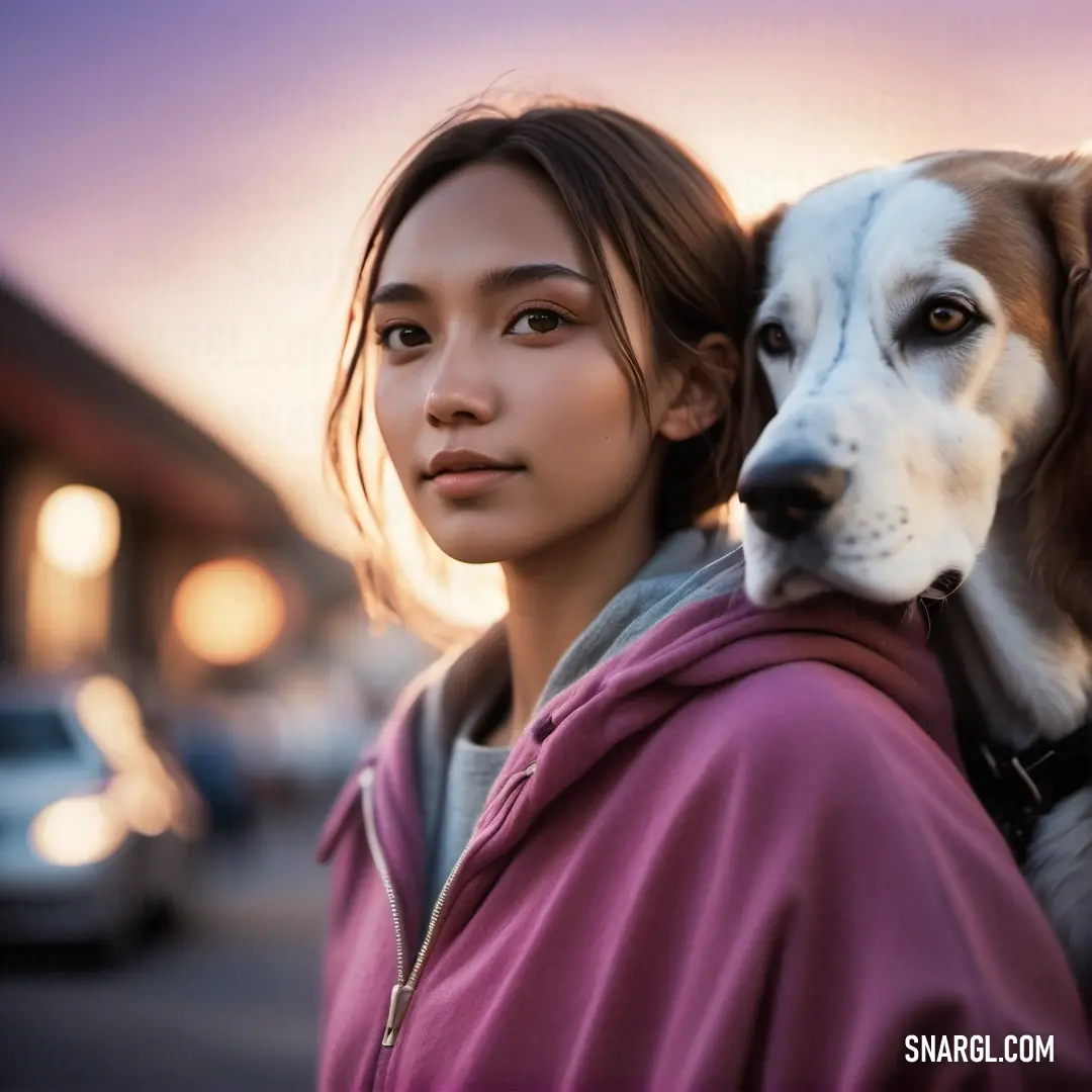 NCS S 3030-R20B color example: Woman holding a dog on her back in a parking lot at sunset or dawn with a dog on her shoulder