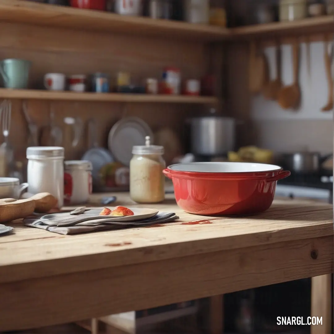 Charming kitchen scene displaying a red bowl filled with colorful kitchen utensils atop a stylish counter. The warm hues and inviting atmosphere breathe life into daily cooking rituals, accentuated by the designated color NCS S 3060-Y70R.