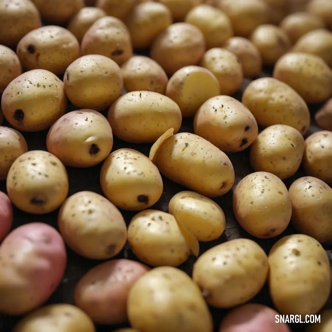 An artistic depiction of potatoes laid out on a table, highlighting their NCS S 4030-Y color in a beautiful array. The knife beside them hints at preparation, capturing the essence of culinary possibility.