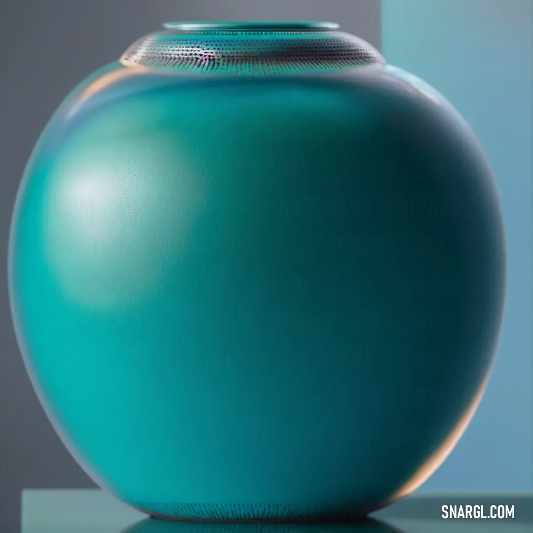 Large blue vase on a table with a gray background. Color #006372.