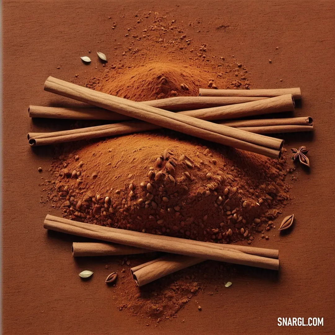 Pile of cinnamon sticks and powder on a table top with cinnamon sticks. Example of CMYK 0,65,80,40 color.