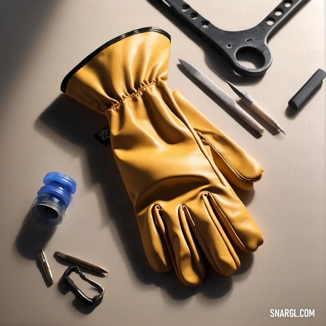 A neatly organized workspace featuring essential tools: a pair of gloves, a wrench, and pliers, demonstrating readiness and versatility for any DIY project.