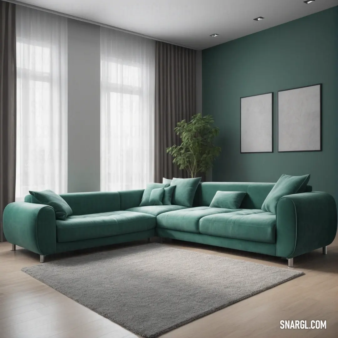 Living room with a large green couch and a rug on the floor and a potted plant in the corner. Example of #808481 color.