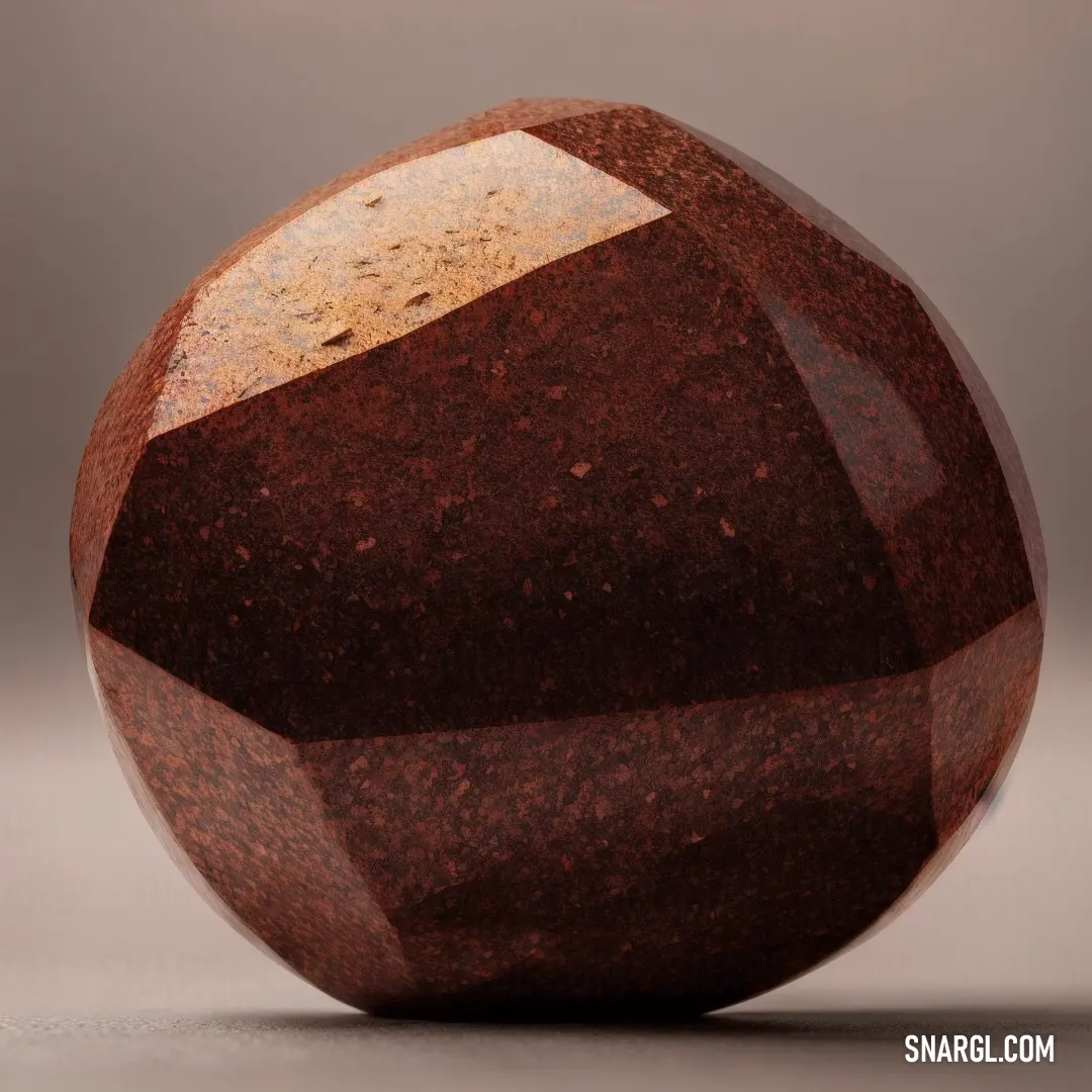 Large brown object on top of a table next to a gray wall and flooring area with a light brown background. Color RGB 128,60,36.