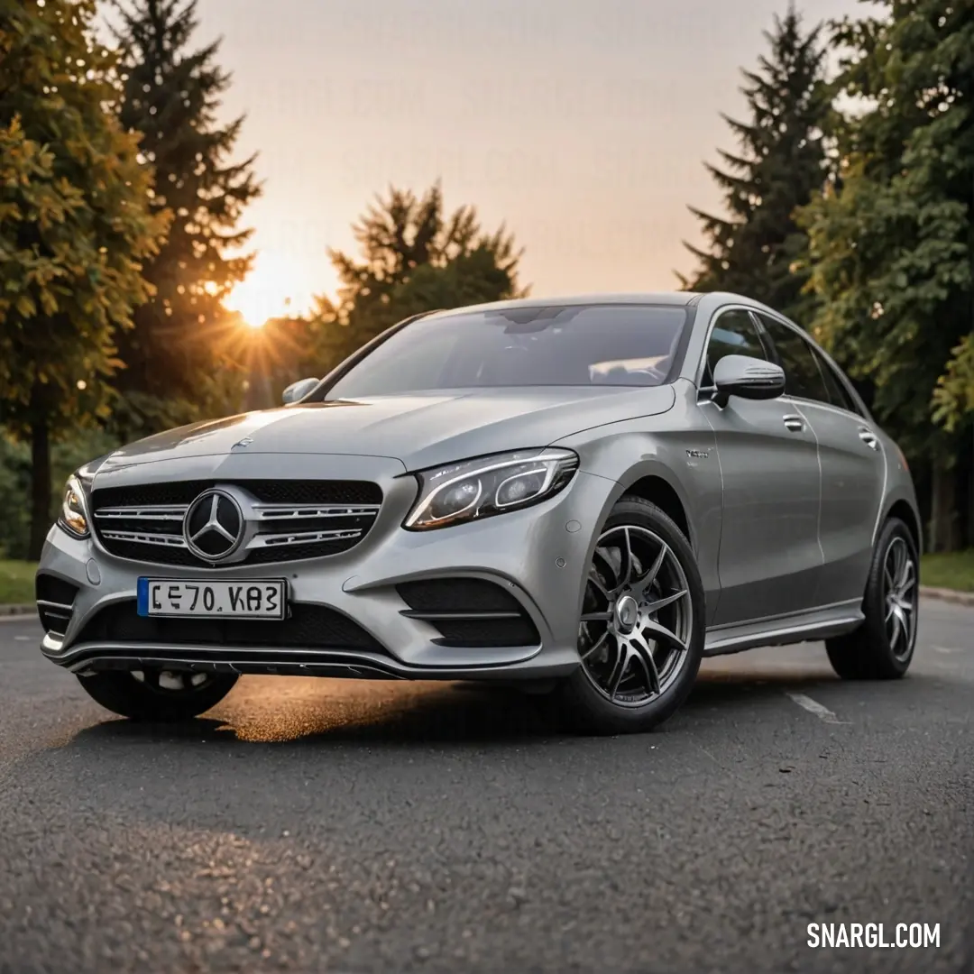 A striking silver Mercedes-Benz glints in the sunlight, showcasing its sleek design and modern features, parked elegantly in an urban setting, surrounded by lush greenery and stunning architecture.