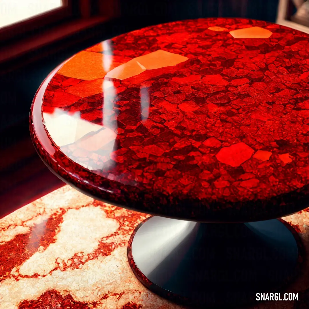 Red table with a black base and a red and orange top on a rug with a window in the background. Color #6C1311.
