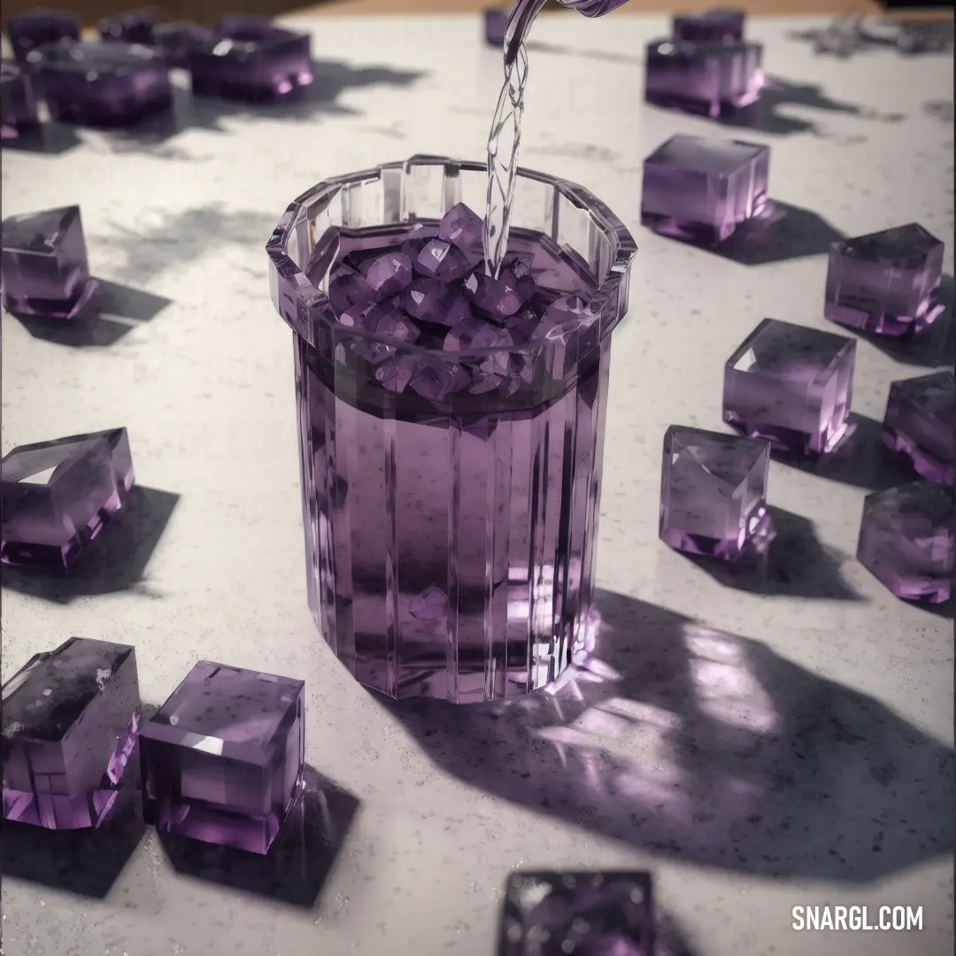 Glass filled with purple cubes on top of a table next to a metal faucet with a water spout. Example of CMYK 32,52,0,68 color.