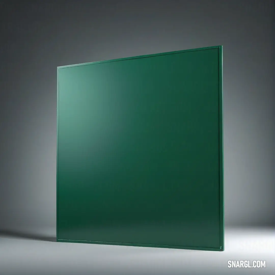 Green glass block on a gray background. Color #004039.
