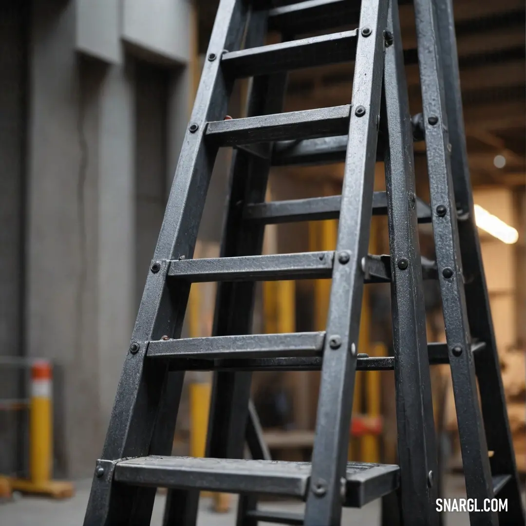 A tall ladder stands confidently in a spacious warehouse, its sturdy frame complemented by a bold yellow sign. The contrast between the metal ladder and the industrial backdrop evokes a sense of functionality and purpose in the space.