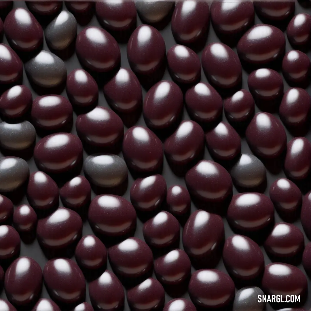 NCS S 8010-Y30R color example: Close up of a bunch of chocolate hearts on a table top with a white border around it