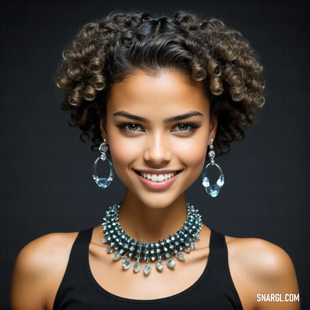 Woman with a necklace and earrings on her neck smiling at the camera with a black background. Color NCS S 8502-B.