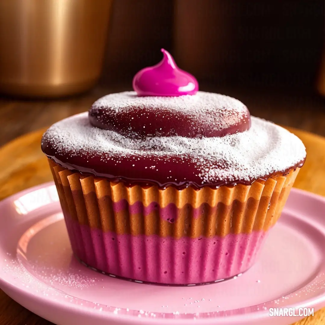 Cupcake with a pink frosting on a pink plate on a wooden table with a gold cupcake holder. Example of #FFA343 color.