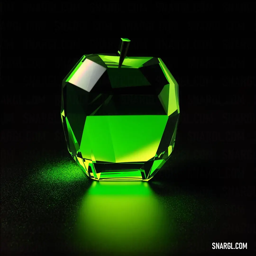 Green apple on top of a table next to a black background with a green light on it