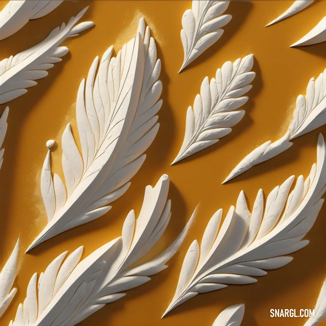 Close up of a white paper sculpture of leaves on a yellow background. Color Ochre.