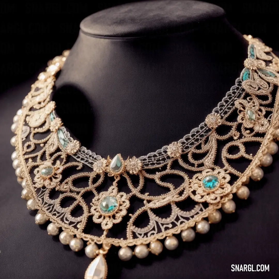 Necklace with pearls and a drop of turquoise stones on a mannequin neckline