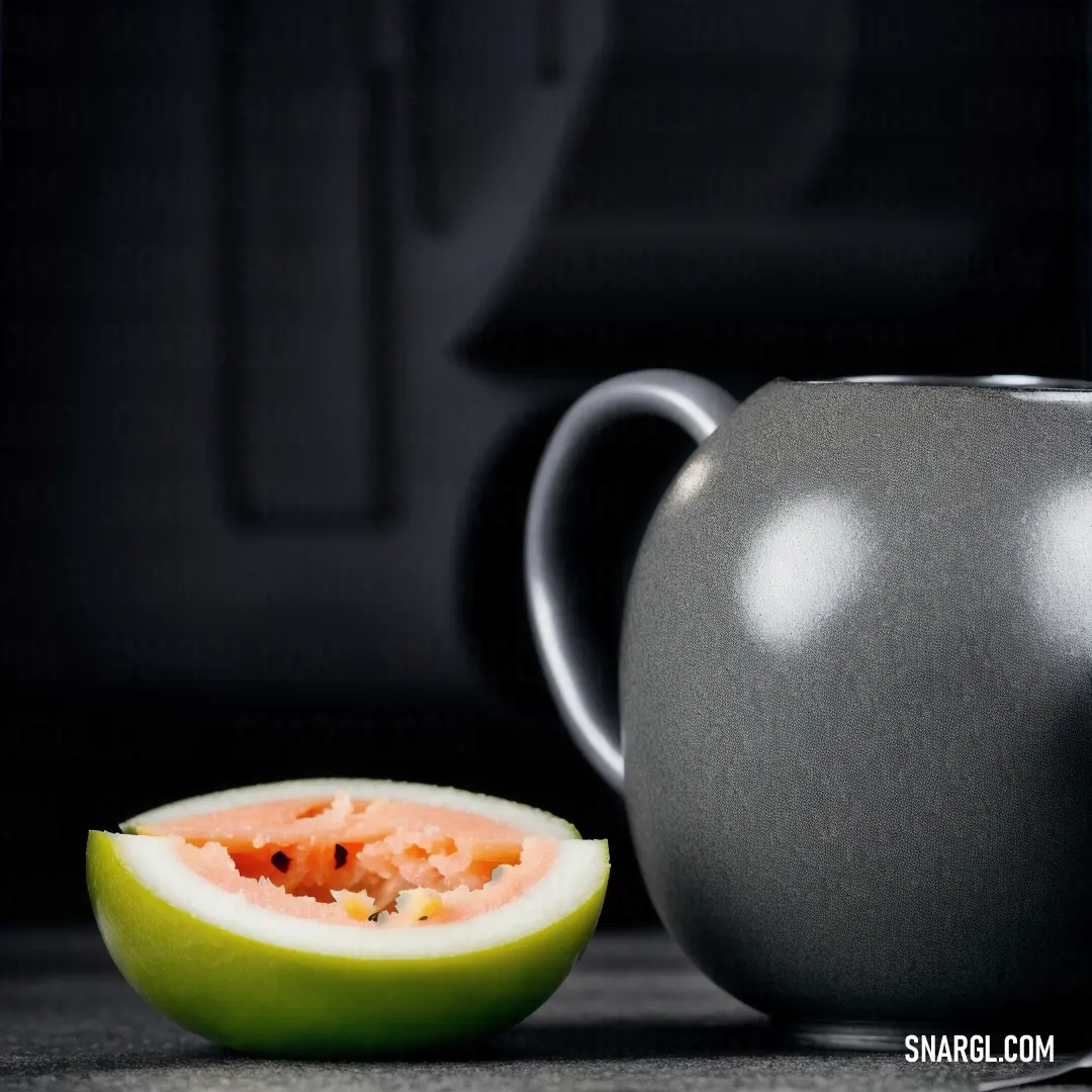 A large gray pitcher sits next to a partially eaten slice of watermelon on a table, accompanied by a knife and fork. The soft tones of the melon contrast with the cool gray pitcher, creating a relaxed, summertime vibe.