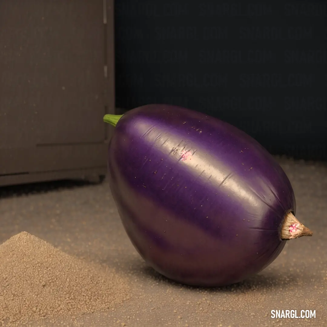 Purple eggplant on a carpet next to a cabinet and a door in a room