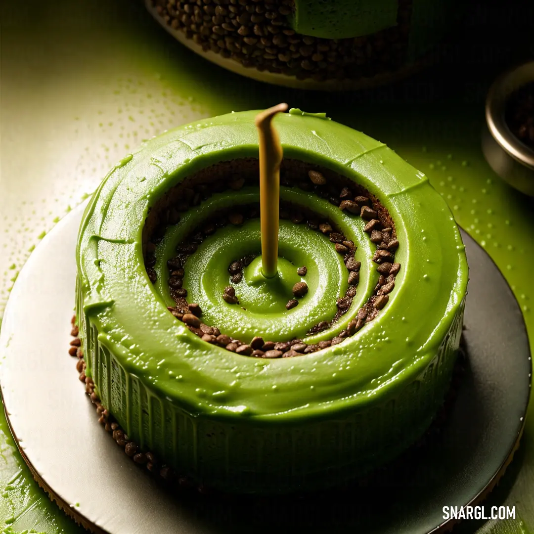 Cake with a candle in the middle of it on a plate with a green background. Color RGB 128,128,0.