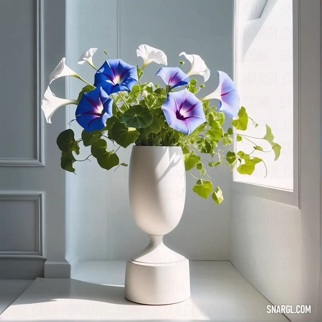 Vase with flowers in it on a window sill next to a window sill with a white frame. Color CMYK 0,0,100,50.